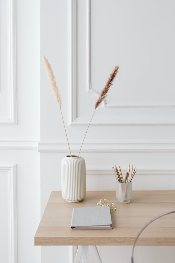 Minimalist desk setup with elegant decor and stationery for a clean and serene workspace.